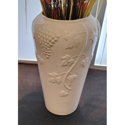 541 - Tall 44cm White Vase containing Artificial Flowers. Overall height 98cm. This Lot is Collection Only... 