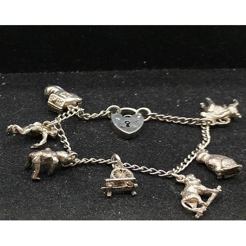 99 - Silver Charm Bracelet plus 925 Silver Bracelet.