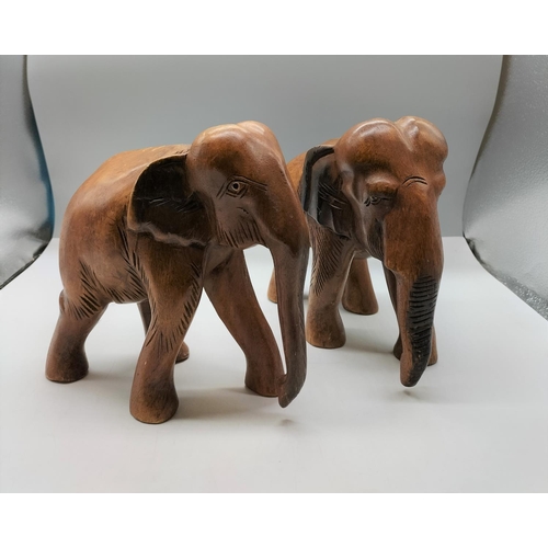 49 - Wooden Carved Elephant Figures (2). 26cm x 23cm.