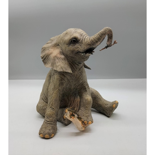 50 - Country Artists Figure of a Baby Elephant CA02995. Slight A/F to Branches. 25cm x 21cm.