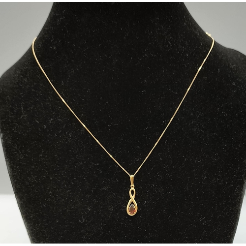 134 - 9ct 375 Gold Chain with Red Stone Pendant.