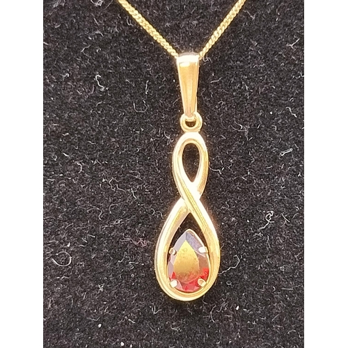 134 - 9ct 375 Gold Chain with Red Stone Pendant.