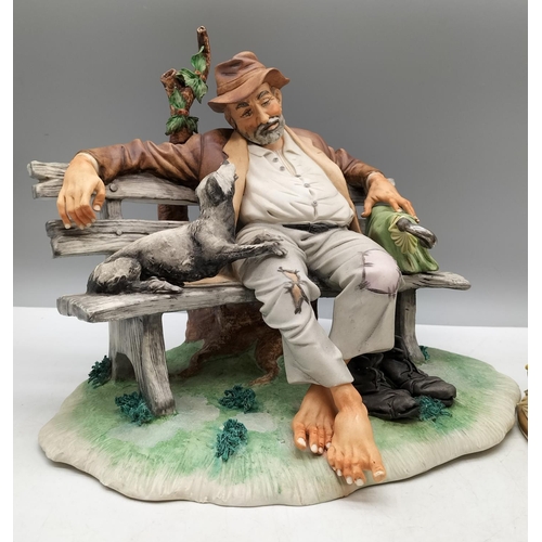 17 - Capodimonte Figure of a Tramp on a Bench with Dog (22cm x 25cm) plus another Figure 'The Artist'. A/... 