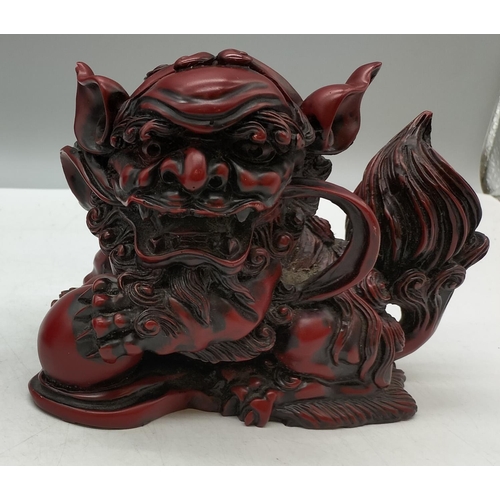 240 - Pair of Red Resin Oriental Foo Dogs, 14cm x 12cm. One A/F.