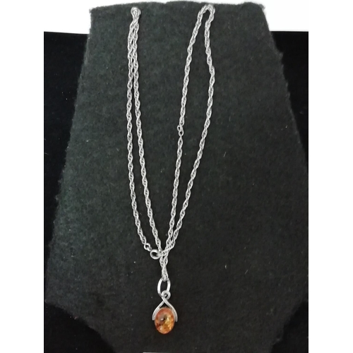 268 - White Metal and Amber Pendant and Chain.