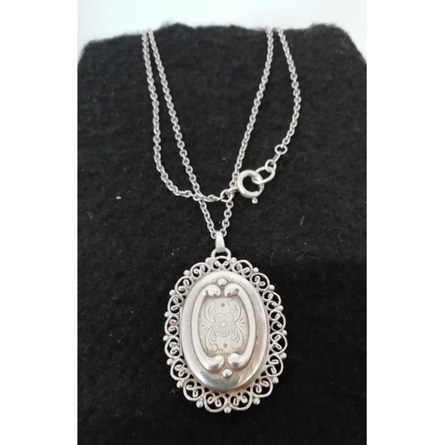 269 - 925 Silver Locket with Openwork Surround and Chain.