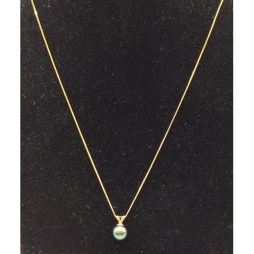 295 - 9ct Gold and Black Pearl Pendant and Chain.