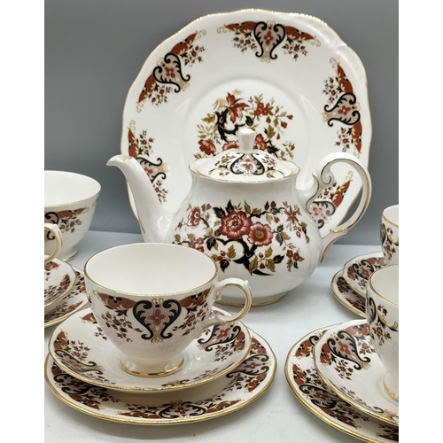 393 - Colclough Bone China 16 Piece Tea Set Pattern E575 in Wicker Basket. 31cm x 43cm x 18cm.