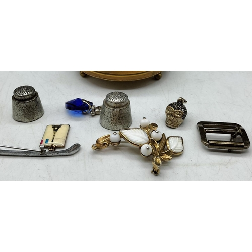 461 - Round Brass Box with Contents including Trifari Brooch and Eiffel Tower Enamel Pendant, etc.