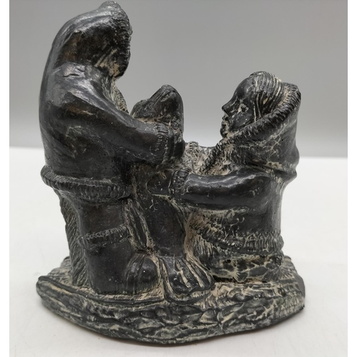 572 - A Wolf Original Sculpture of Inuit/Eskimos with Seal. 11cm x 12cm. Chip to Base but Displays Well.