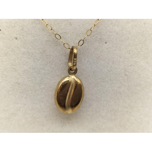 74 - 9k Chain and Coffee Bean Pendant. 0.7 Gram