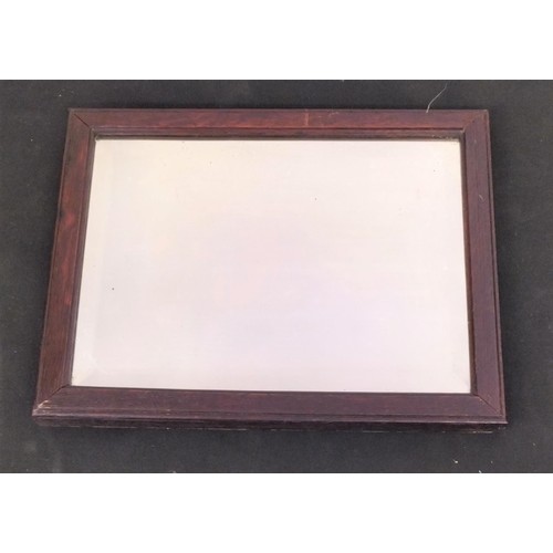 257 - Oak Framed Bevel Edged Mirror. 34cm x 27cm.