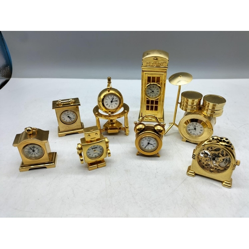 100 - Miniature Brass Clocks (8). Various Designs.