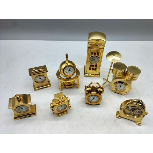 100 - Miniature Brass Clocks (8). Various Designs.