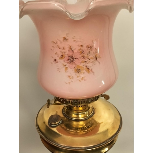 18 - Brass Column Oil Lamp with Pink Shade. 76cm High Including Shade and Funnel.