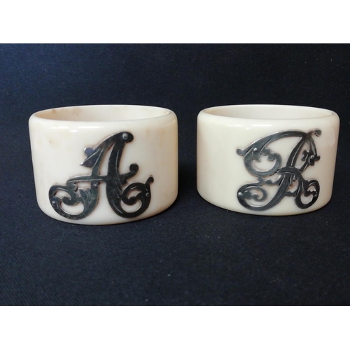 233 - Pair of Edwardian Celluloid Napkin Rings with Silver Monograms.