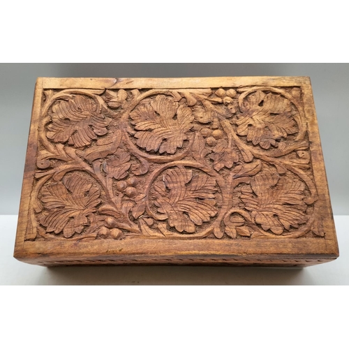 254 - Carved Wooden Box containing Costume Jewellery. 10cm High, 31cm x 20cm.