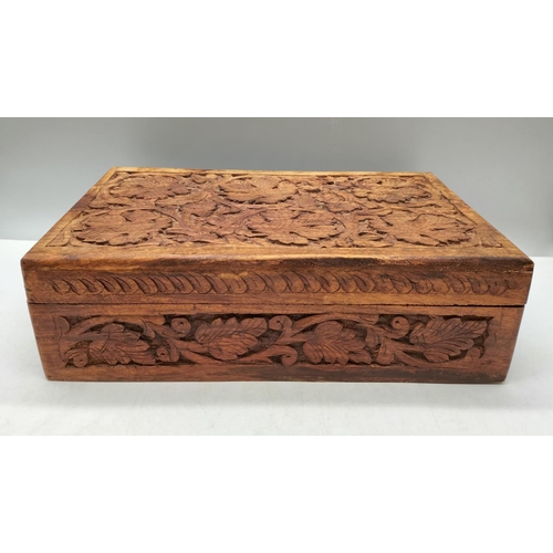 254 - Carved Wooden Box containing Costume Jewellery. 10cm High, 31cm x 20cm.