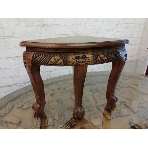 297 - Chinese Carved Design Glass Top Table plus 6 Stools (36cm High). Table measures 125cm x 75cm x 52cm.... 