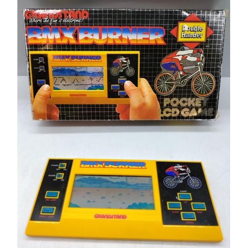 371 - Grandstand 'Bmx Burner' Electronic Game W/O. Boxed with Instructions. Excellent Condition.