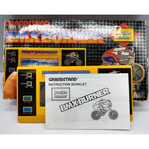 371 - Grandstand 'Bmx Burner' Electronic Game W/O. Boxed with Instructions. Excellent Condition.