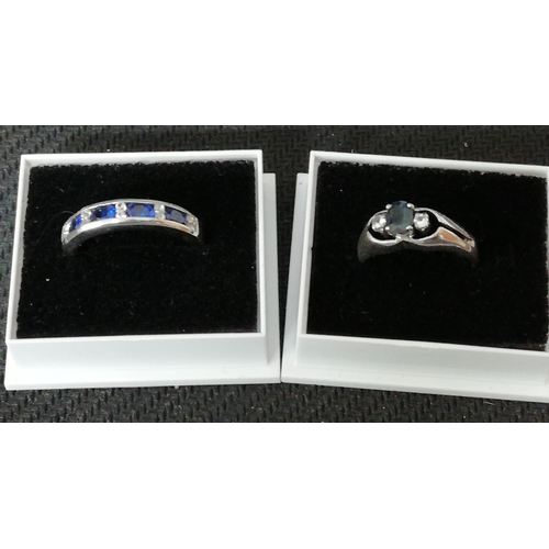 438 - 925 Silver Rings (2) set with Sapphires and Crystals. Size J.