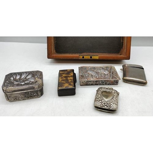 69 - Wooden Box with Contents including Vestas, Snuff Box, etc. Box measures 20cm x 19cm x 9cm.