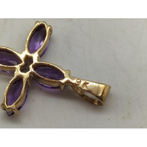 48 - 9ct Gold Cross set with Amethysts. Marked 9k. All Stones Tested by Vendor.