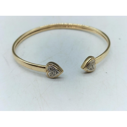 130A - 9ct Gold Heart Diamond Chip Taut Bangle. 4.8 Grams. Stones Checked by Vendor.