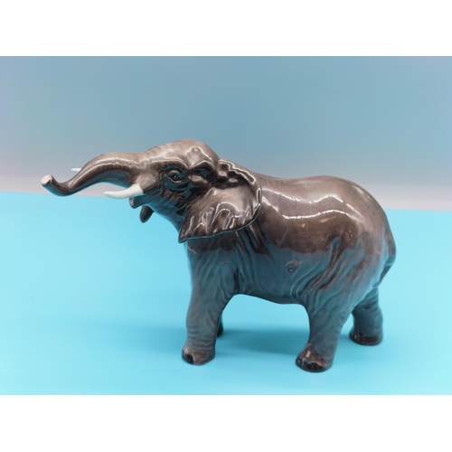 148 - Beswick Figure of a Baby Elephant. 18cm x 12cm.