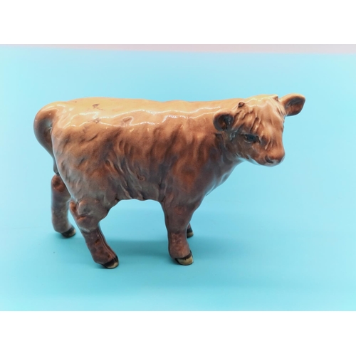 149 - Beswick Figure of a Highland Calf. 10cm x 7cm.