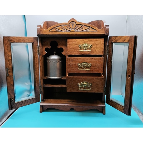 21 - Smokers Cabinet with 3 Drawers, Bevelled Edged Glass Door and Brass Hinges. 47cm High, 33cm x 19cm.