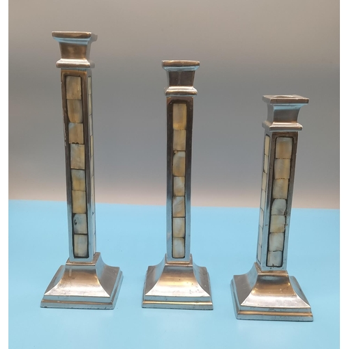 378 - Aluminium with Mother of Pearl Inlay Candlesticks (3). Tallest being 28cm.