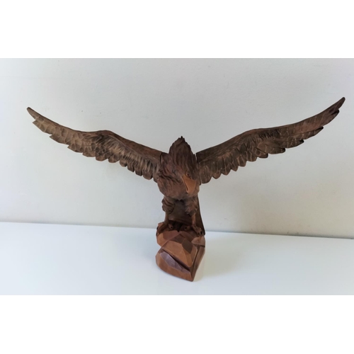 398 - Medium Wooden Carved Eagle. 64cm Wing Span. 28cm High.