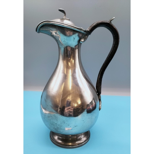 403 - Pewter Lidded 26cm Jug with Leather Handle.