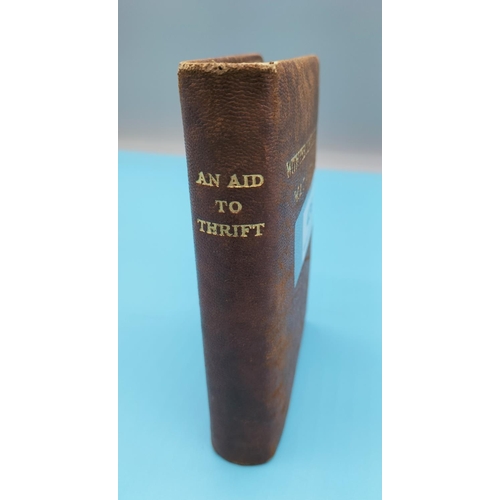 436 - Money Saving Device/Book  'An Aid to Thrift' c1930. 13cm x 9cm x 2.5cm.