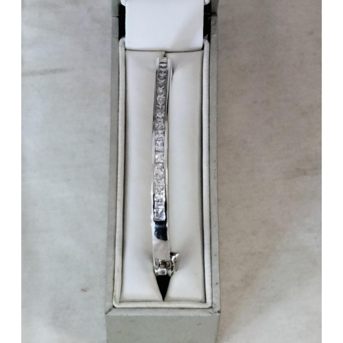 725 - Hallmarked Silver Bangle set with Cubic Zirconia. Boxed.