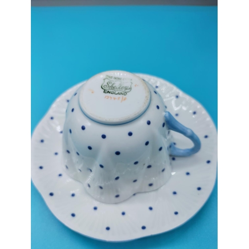 726 - 1940s Shelley Dainty Cup and Saucer in a Blue Dot Pattern.