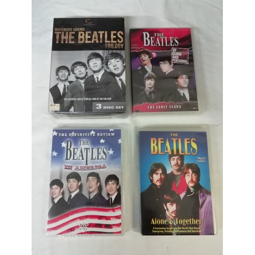 17 - Collection of Beatles memorabilia to include 4 still sealed dvd, pencil sketch print of Jon Lennon, ... 