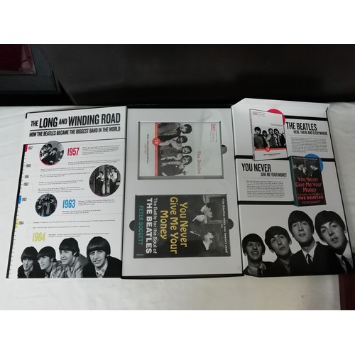 17 - Collection of Beatles memorabilia to include 4 still sealed dvd, pencil sketch print of Jon Lennon, ... 