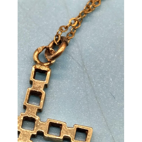 189 - 9ct Gold Cross and Chain. 2.1 Grams.