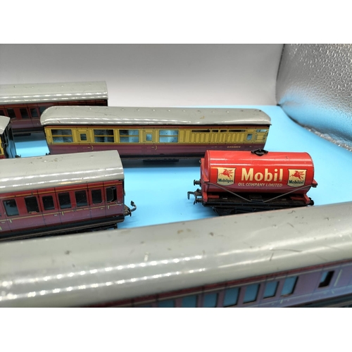 426 - Tin Box of Hornby Carraiges and Carts to include Mobil Oil Company, Power Petrol, Liverpool Cables.