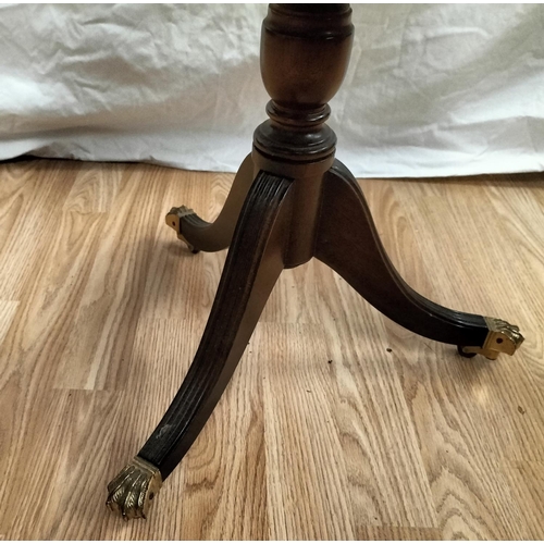 438 - Tri Legged, Brass Claw Feet on Wheels Mahogany? Inlaid Octagonal Table with Glass Top. 50cm High x 5... 