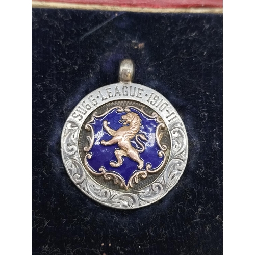 255 - Sugg League 1910-1911  Silver Enamelled with Gold Inlay Medal by T.Fattorini. Cased.