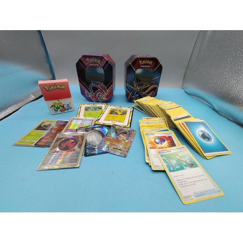 798 - 2 x Pokemon Tins with Assorted Cards and Accessories.