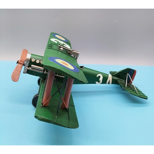 103 - Boxed Tin Model of an Aeroplane. 30cm high x 28cm.