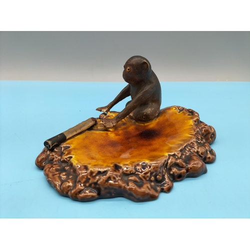 22 - Rare c1900 Bretby Henry Tooth Ashtray displaying a Glass Eyed Monkey and a Part Smoked Cigarette Mou... 