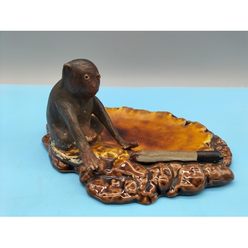 22 - Rare c1900 Bretby Henry Tooth Ashtray displaying a Glass Eyed Monkey and a Part Smoked Cigarette Mou... 