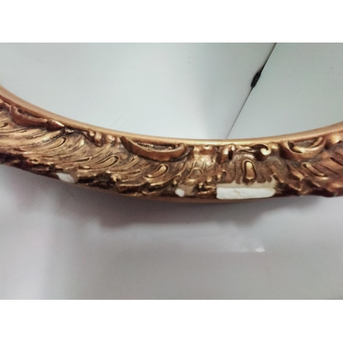 641 - Gold Gilt Oval Mirror. Some Damage to Gilt. 66cm x 56cm. This Lot is Collection Only.