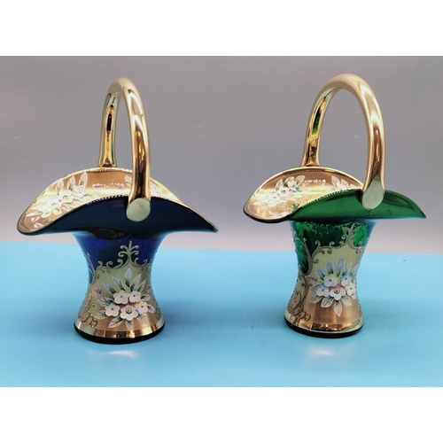 87 - Coloured Glass Baskets (2) with Gold and Enamelled Flowers. 23cm High, 16cm x 14cm.